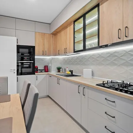 Stylish Gold Accents Apartment Bucharest
